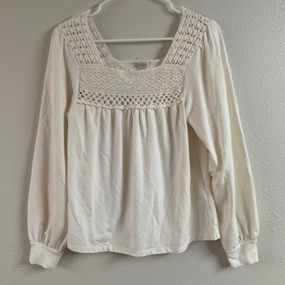 Hinge top with crochet neck. Washed, never worn.